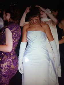 A friend fixing my hair at senior year Prom
